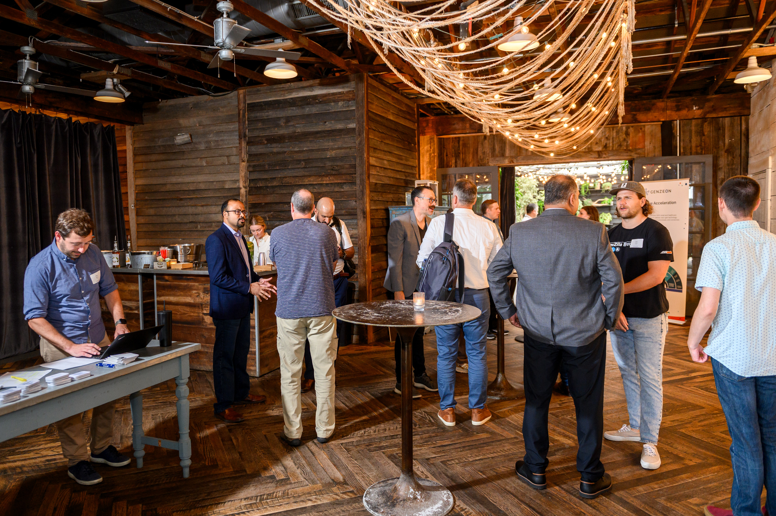 genzeon retail technology event in terrain cafe garden shed, showing multiple business people networking